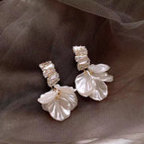 Hivava  -  New Classic Fashion Glossy Earrings Women Simple Korean White Shell Flower Earrings Temperament Light Luxury Jewelry Gift